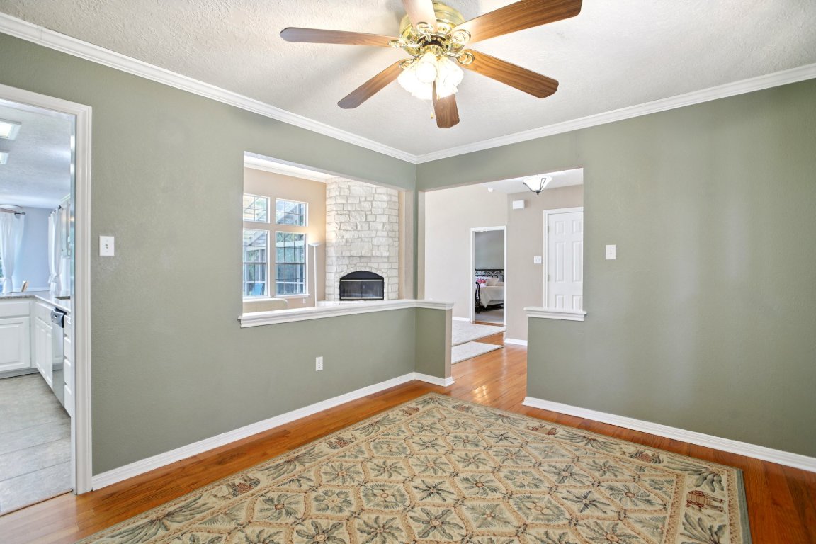 148 Oak Ridge Drive Cedar Creek, TX 78612 - Photo 20 of 40 wooden floor in an empty room with a window