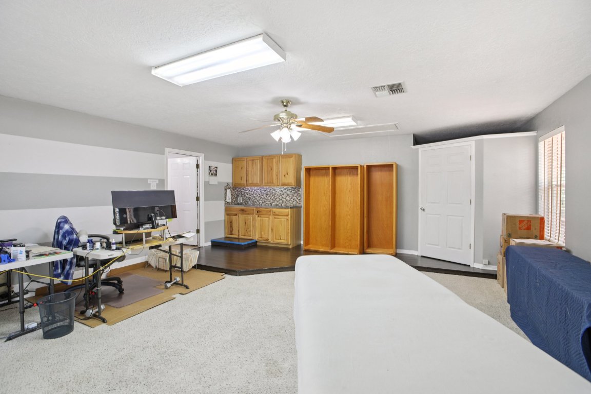 148 Oak Ridge Drive Cedar Creek, TX 78612 - Photo 21 of 40 a living room with furniture and a flat screen tv