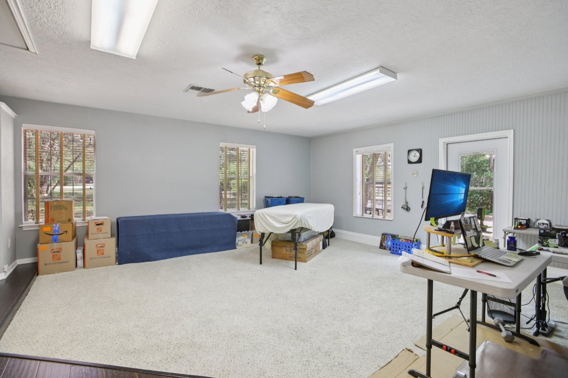 148 Oak Ridge Drive Cedar Creek, TX 78612 - Photo 22 of 40 a living room with furniture and a flat screen tv