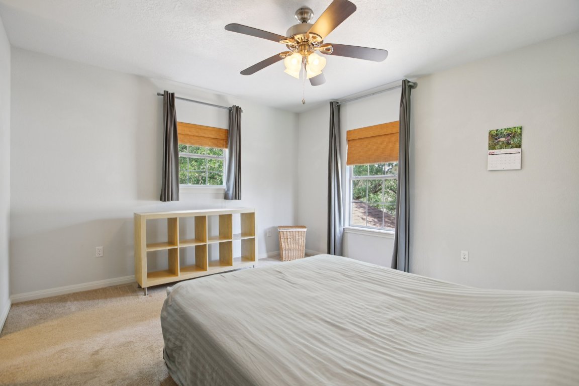 148 Oak Ridge Drive Cedar Creek, TX 78612 - Photo 30 of 40 a bedroom with a bed and a window