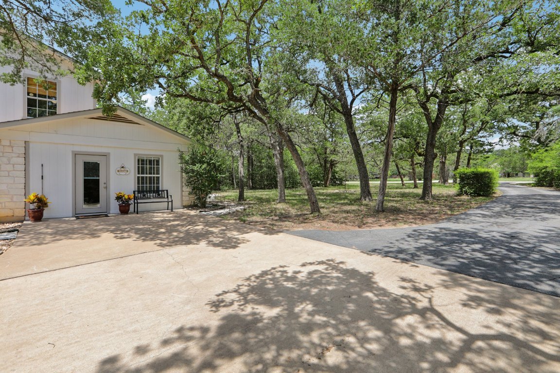 148 Oak Ridge Drive Cedar Creek, TX 78612 - Photo 37 of 40 a view of a house with a yard