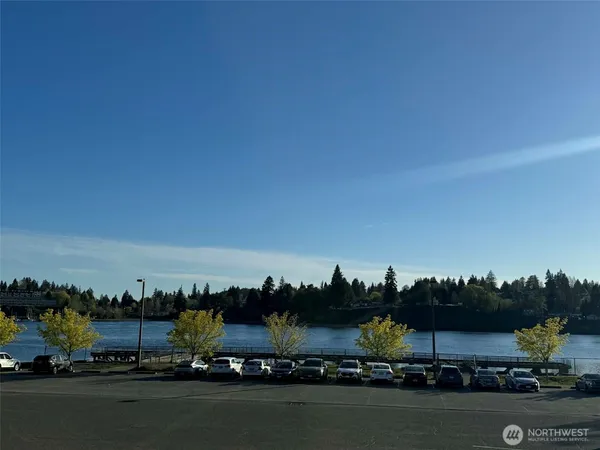 a bathroom with a sink toilet a mirror and shower