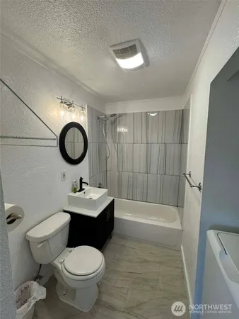 a kitchen with a refrigerator and a sink