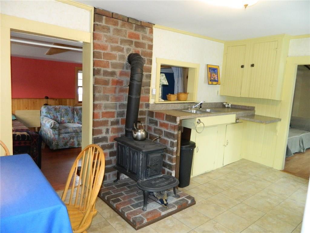 49 Howe Hill Road Greenwood, ME 04255 - Photo 5 of 18 Cozy woodstove with a brick hearth. ...