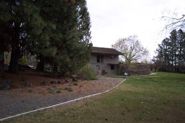 811 Bittner Road Yakima, WA 98901 - Photo 2 of 9 a view of a house with yard and a tree