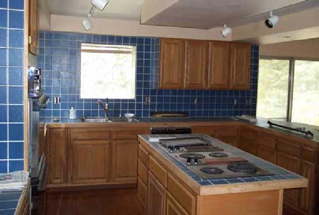811 Bittner Road Yakima, WA 98901 - Photo 3 of 9 a kitchen with granite countertop a stove a sink dishwasher and cabinets