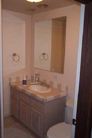 811 Bittner Road Yakima, WA 98901 - Photo 6 of 9 a bathroom with a toilet sink and mirror