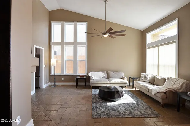 a living room with furniture and a window