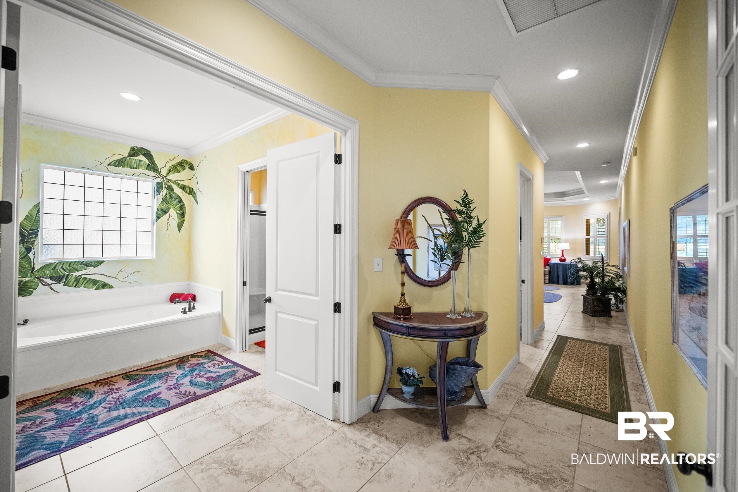 404 Peninsula Boulevard Gulf Shores, AL 36542 - Photo 30 of 51 Corridor with crown molding, healthy amount of natural light, recessed lighting, and light tile patterned flooring
