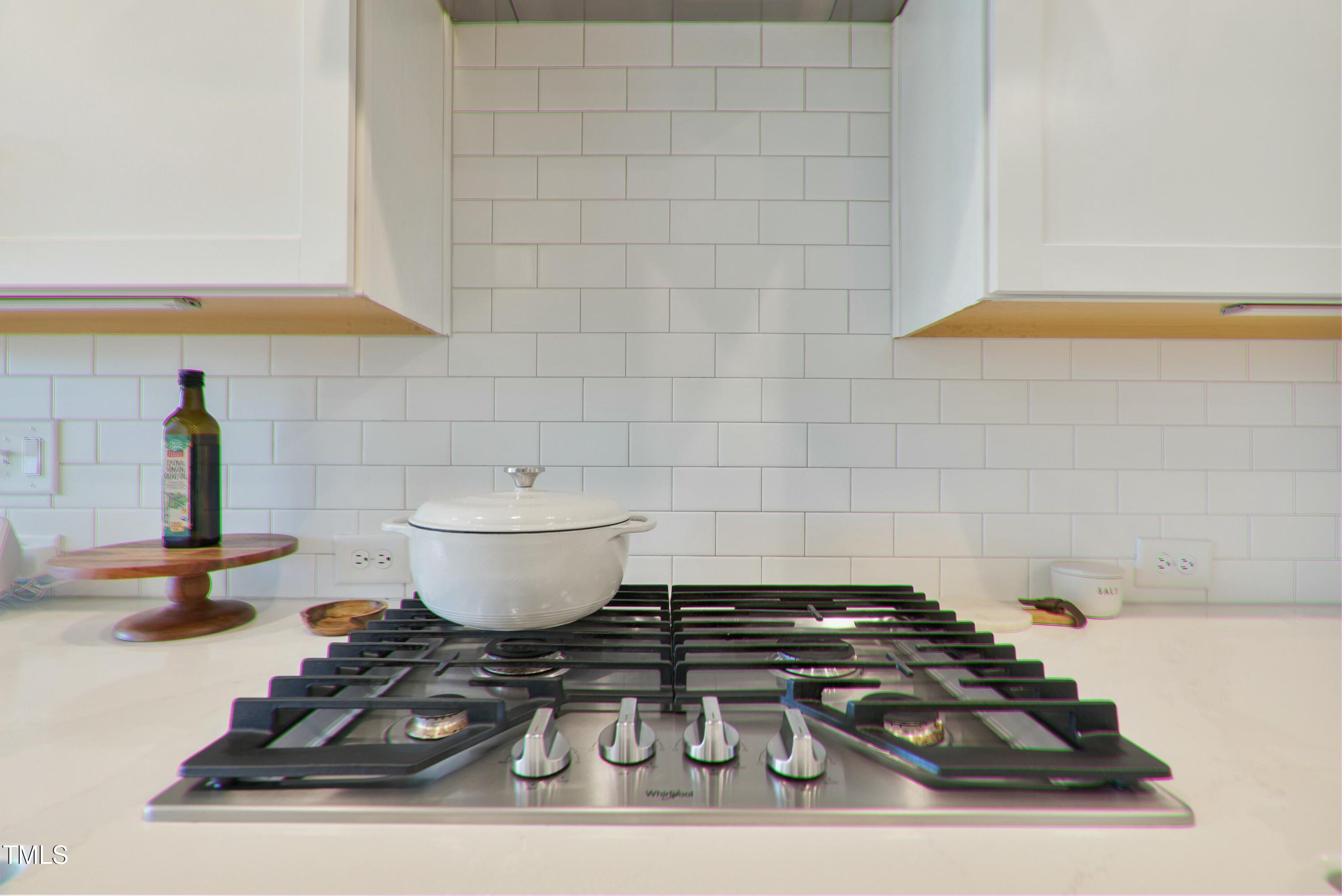 512 Adkins Ridge Road Rolesville, NC 27571 - Photo 17 of 53 a bathroom with a sink and a stove