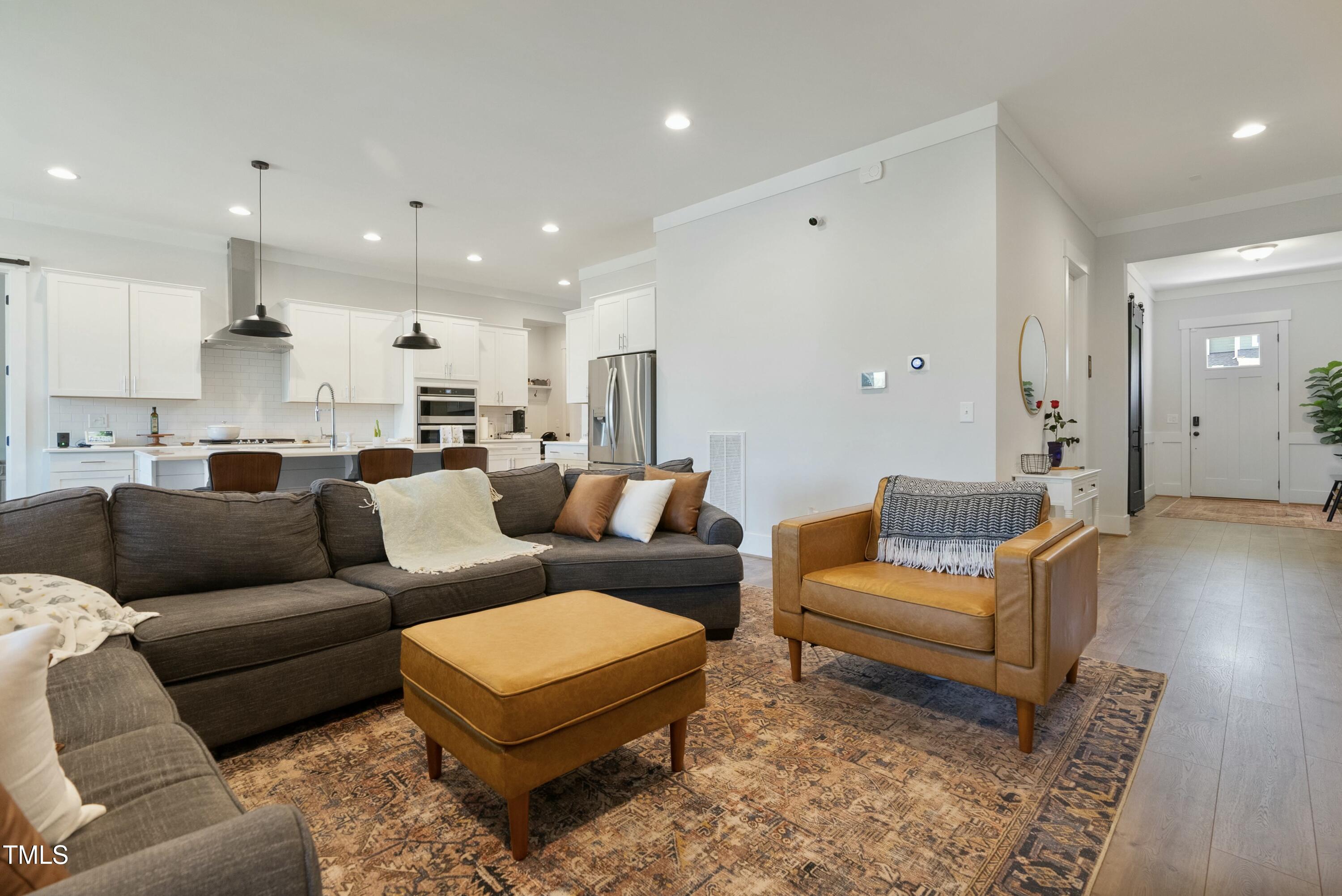 512 Adkins Ridge Road Rolesville, NC 27571 - Photo 21 of 53 a living room with furniture and a view of kitchen