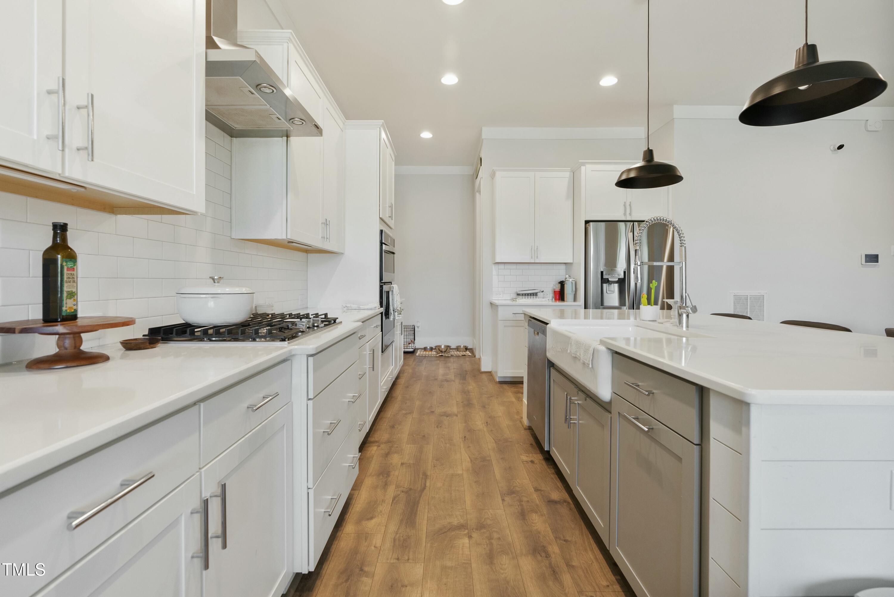 512 Adkins Ridge Road Rolesville, NC 27571 - Photo 22 of 53 a kitchen with a sink and cabinets