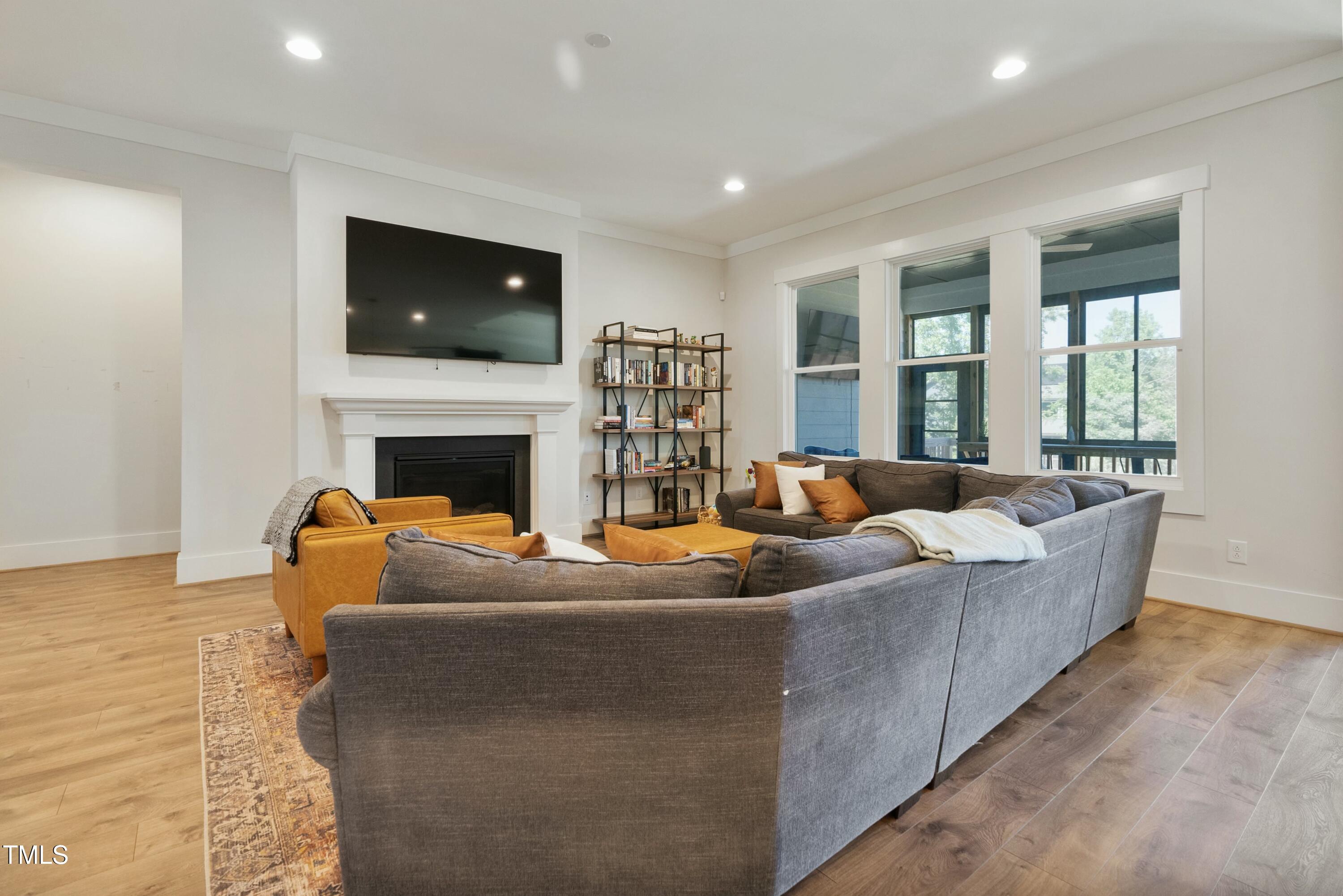 512 Adkins Ridge Road Rolesville, NC 27571 - Photo 25 of 53 a living room with furniture and a fireplace