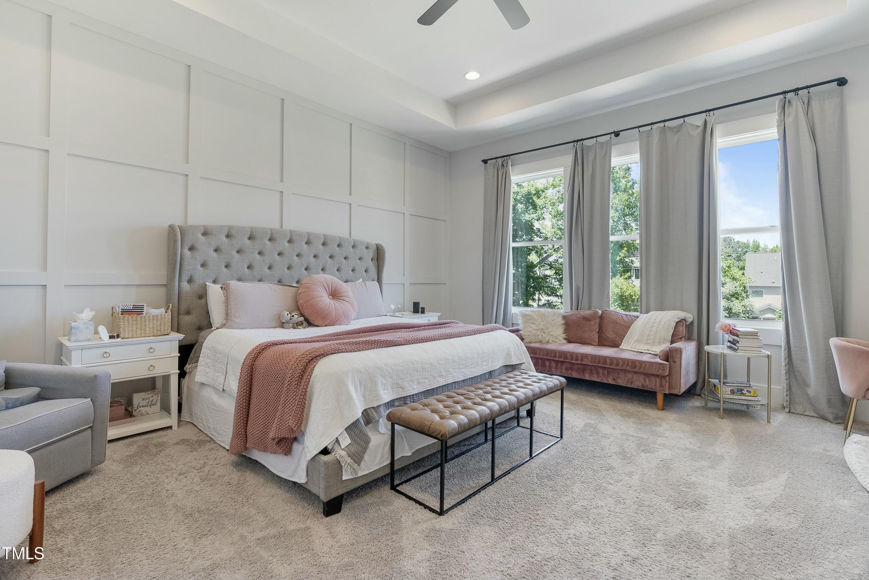 512 Adkins Ridge Road Rolesville, NC 27571 - Photo 28 of 53 a bedroom with a bed and a couch