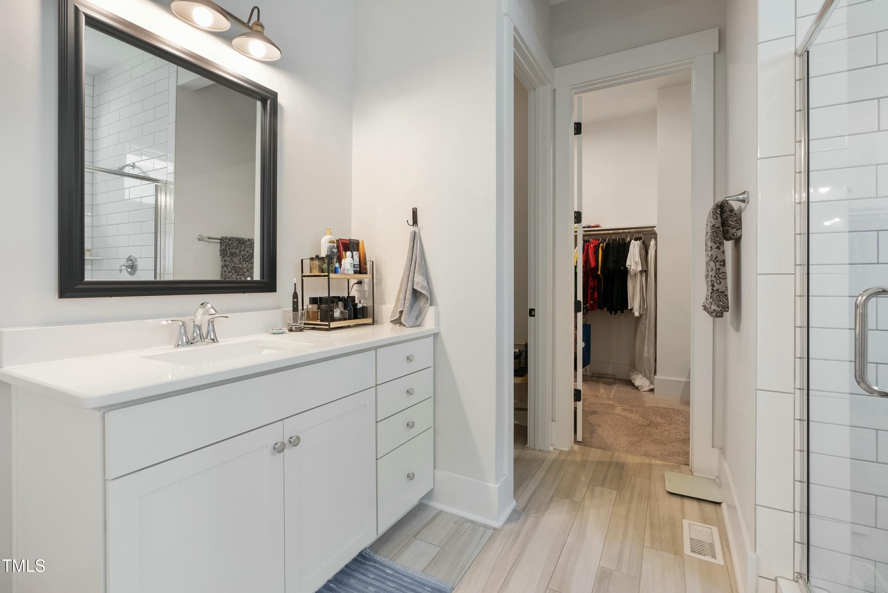 512 Adkins Ridge Road Rolesville, NC 27571 - Photo 31 of 53 a bathroom with a sink and a mirror