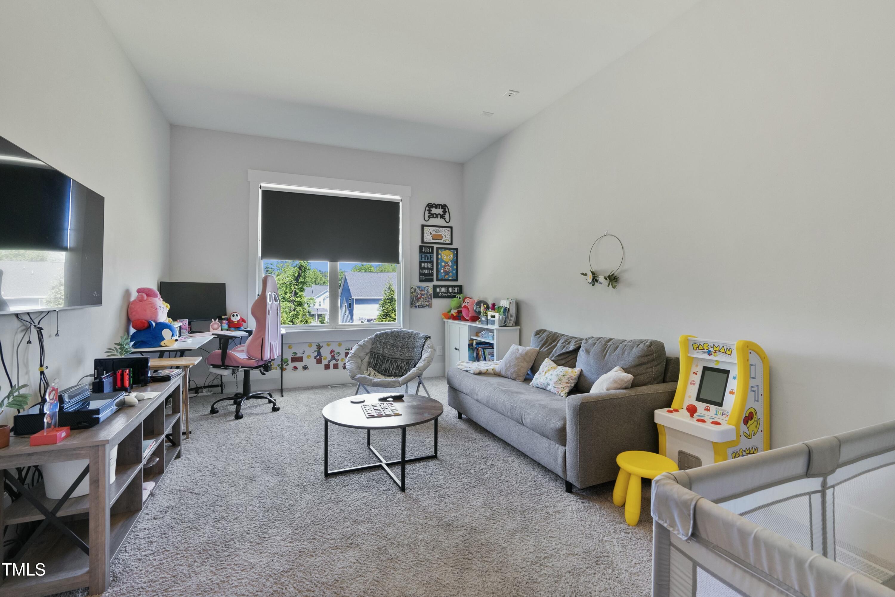 512 Adkins Ridge Road Rolesville, NC 27571 - Photo 39 of 53 a living room with furniture and a flat screen tv