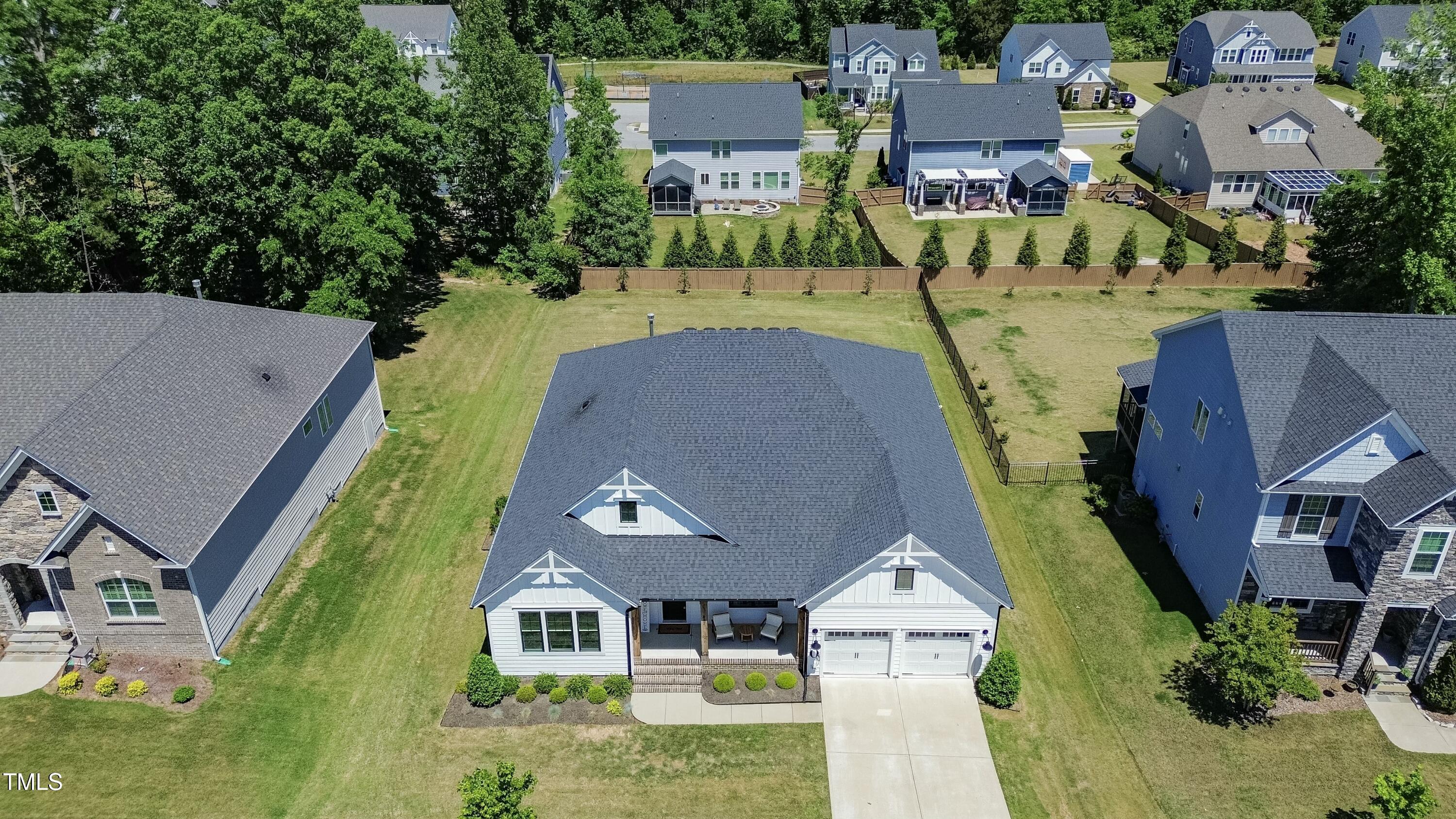 512 Adkins Ridge Road Rolesville, NC 27571 - Photo 47 of 53 an aerial view of a house with swimming pool and large trees