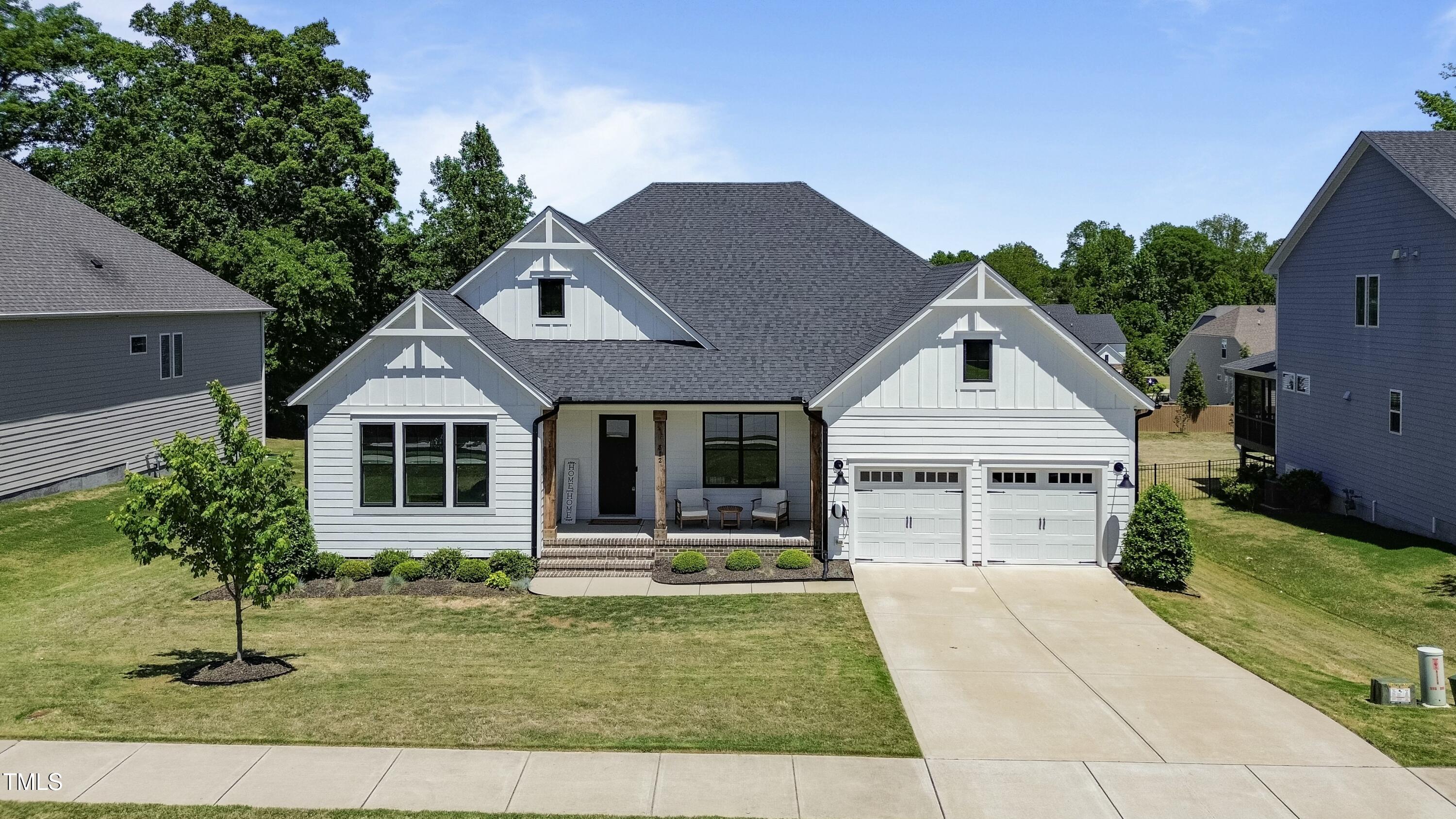 512 Adkins Ridge Road Rolesville, NC 27571 - Photo 51 of 53 a front view of a house with a yard
