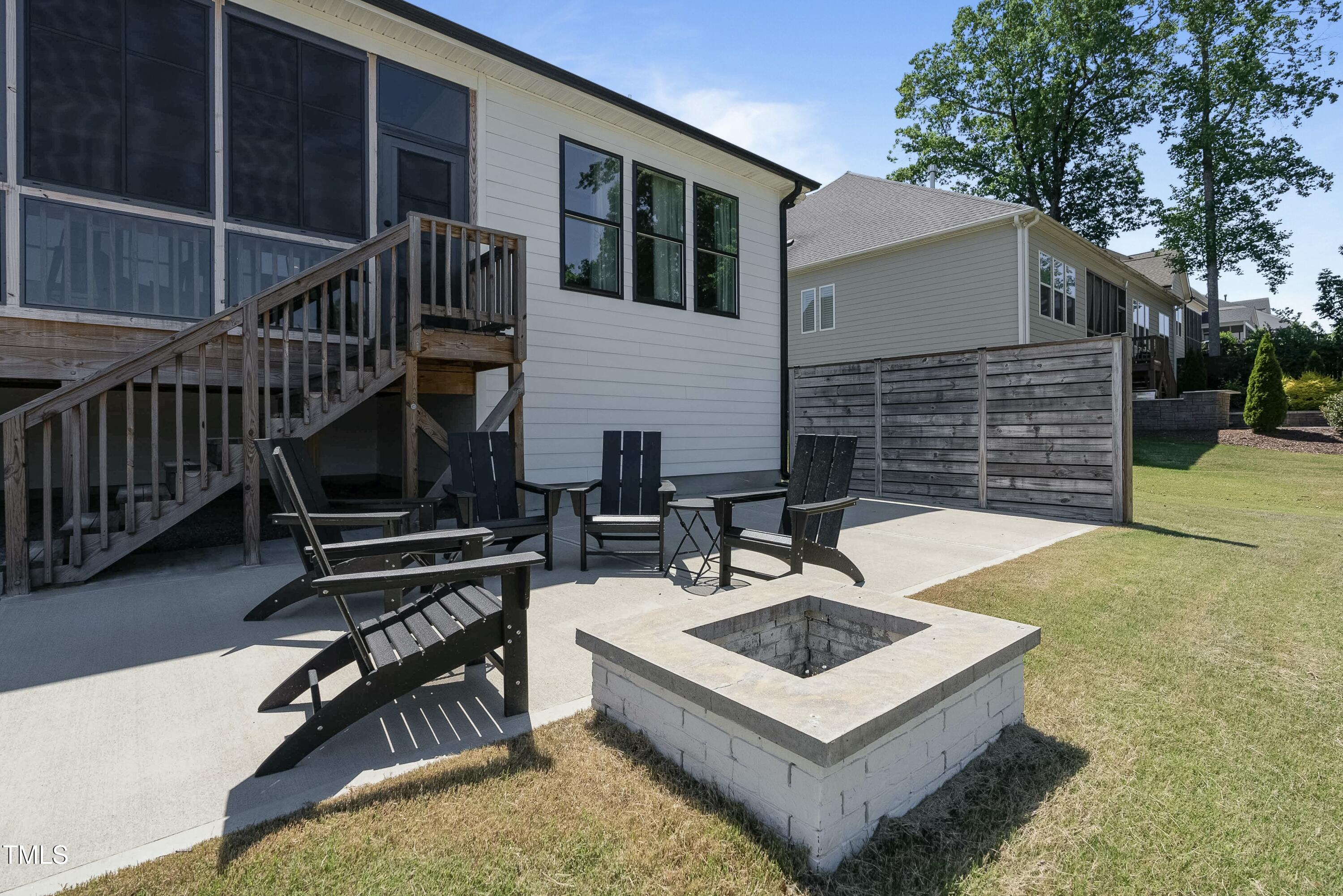512 Adkins Ridge Road Rolesville, NC 27571 - Photo 7 of 53 a white building that has a table and chairs in it