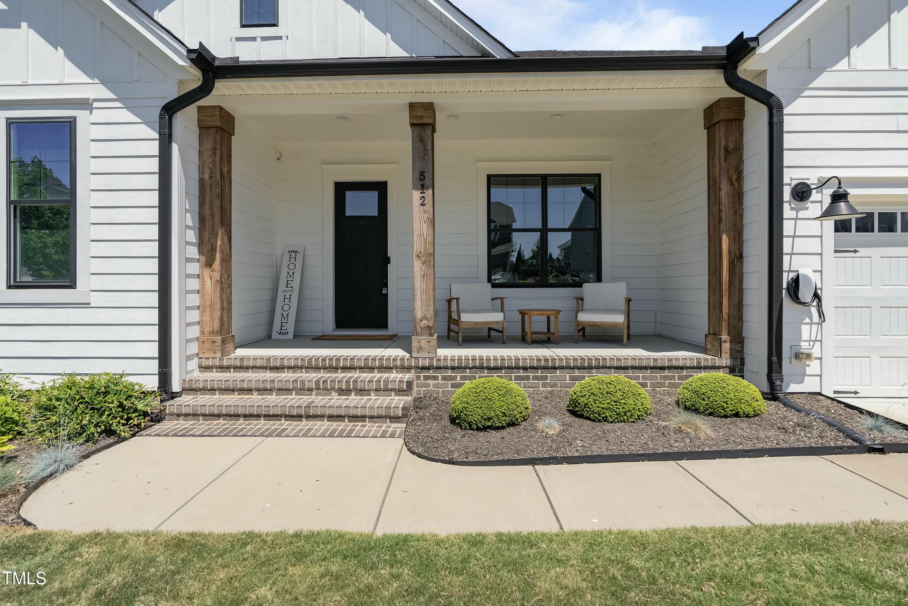 512 Adkins Ridge Road Rolesville, NC 27571 - Photo 8 of 53 a front view of a house with sitting area