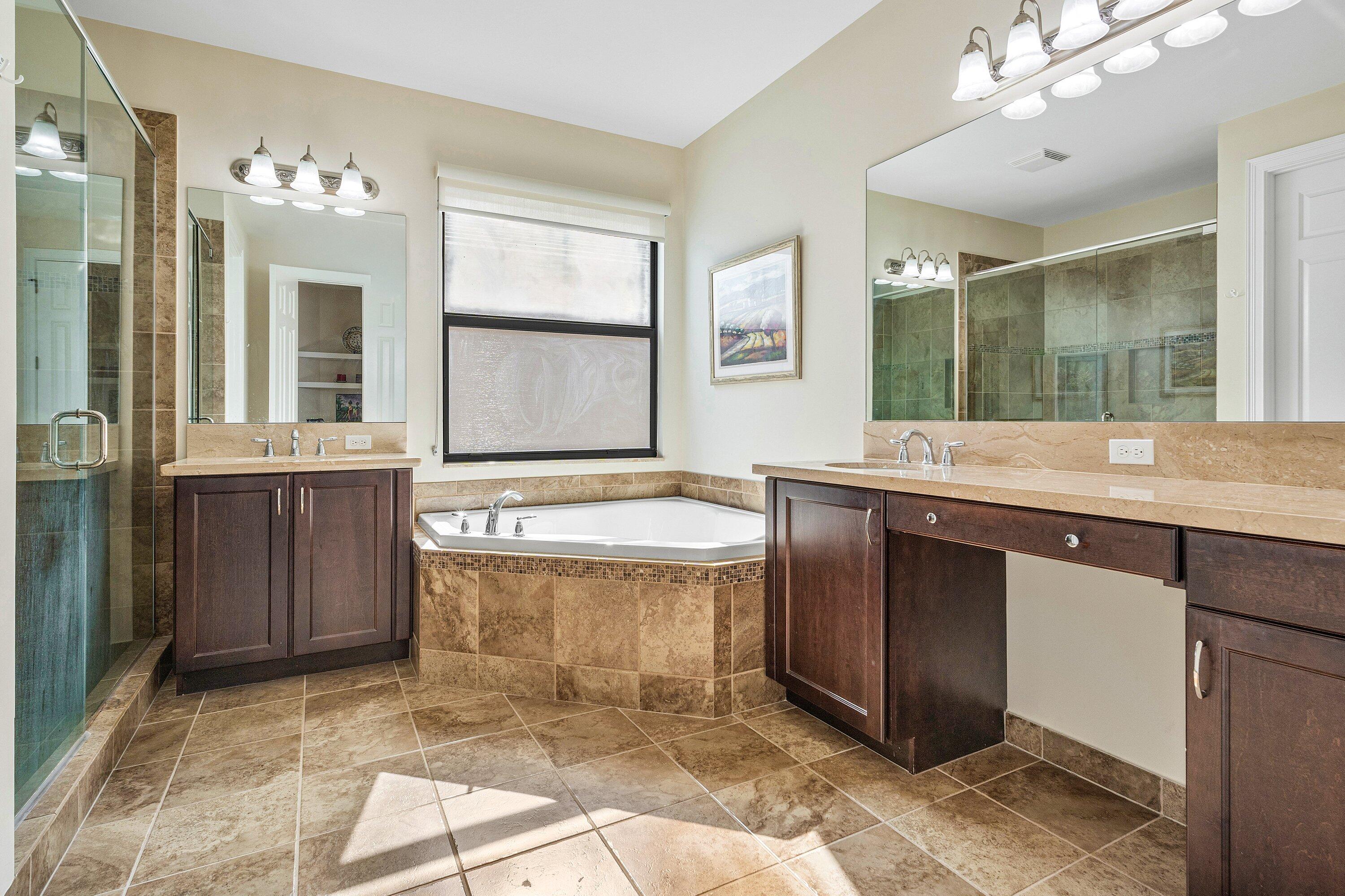 9349 Eden Roc Court Delray Beach, FL 33446 - Photo 18 of 50 a bathroom with a granite countertop sink and a mirror