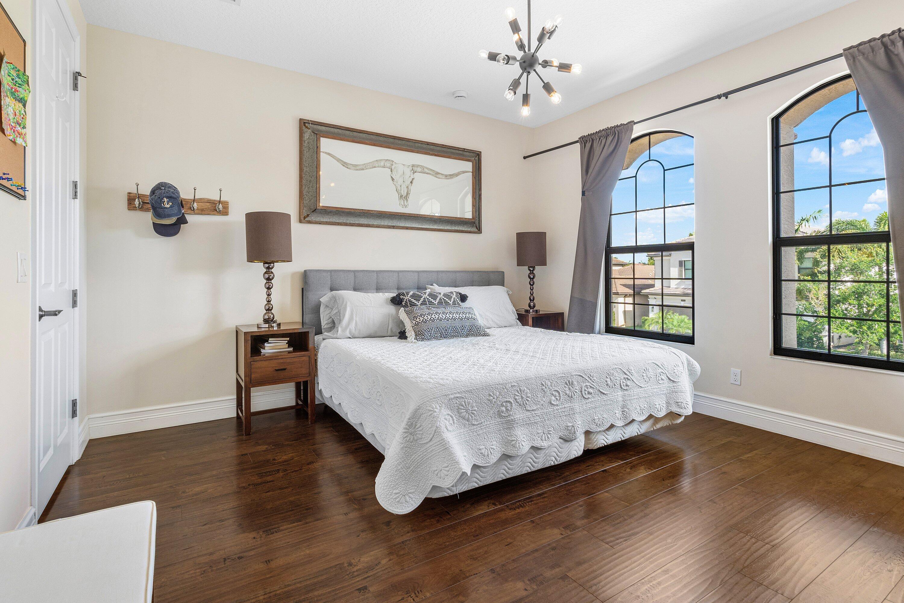 9349 Eden Roc Court Delray Beach, FL 33446 - Photo 19 of 50 a bedroom with a large bed and a window