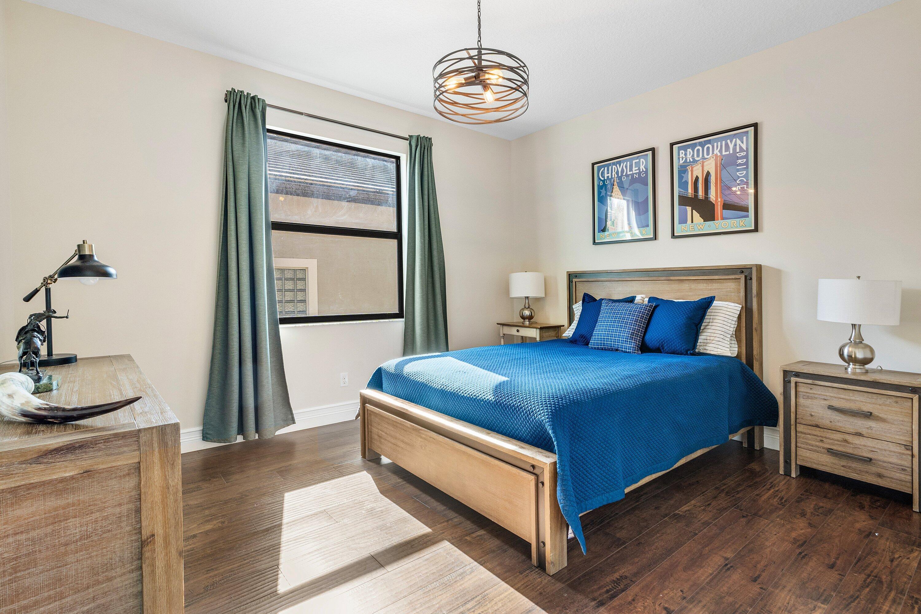 9349 Eden Roc Court Delray Beach, FL 33446 - Photo 21 of 50 a bedroom with a bed and a window