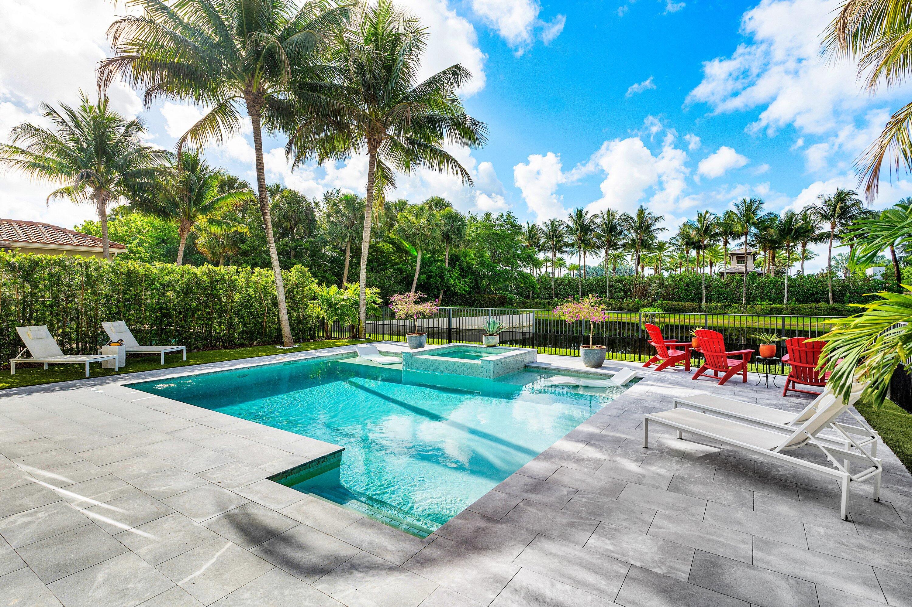 9349 Eden Roc Court Delray Beach, FL 33446 - Photo 24 of 50 a view of a park with swings and slides