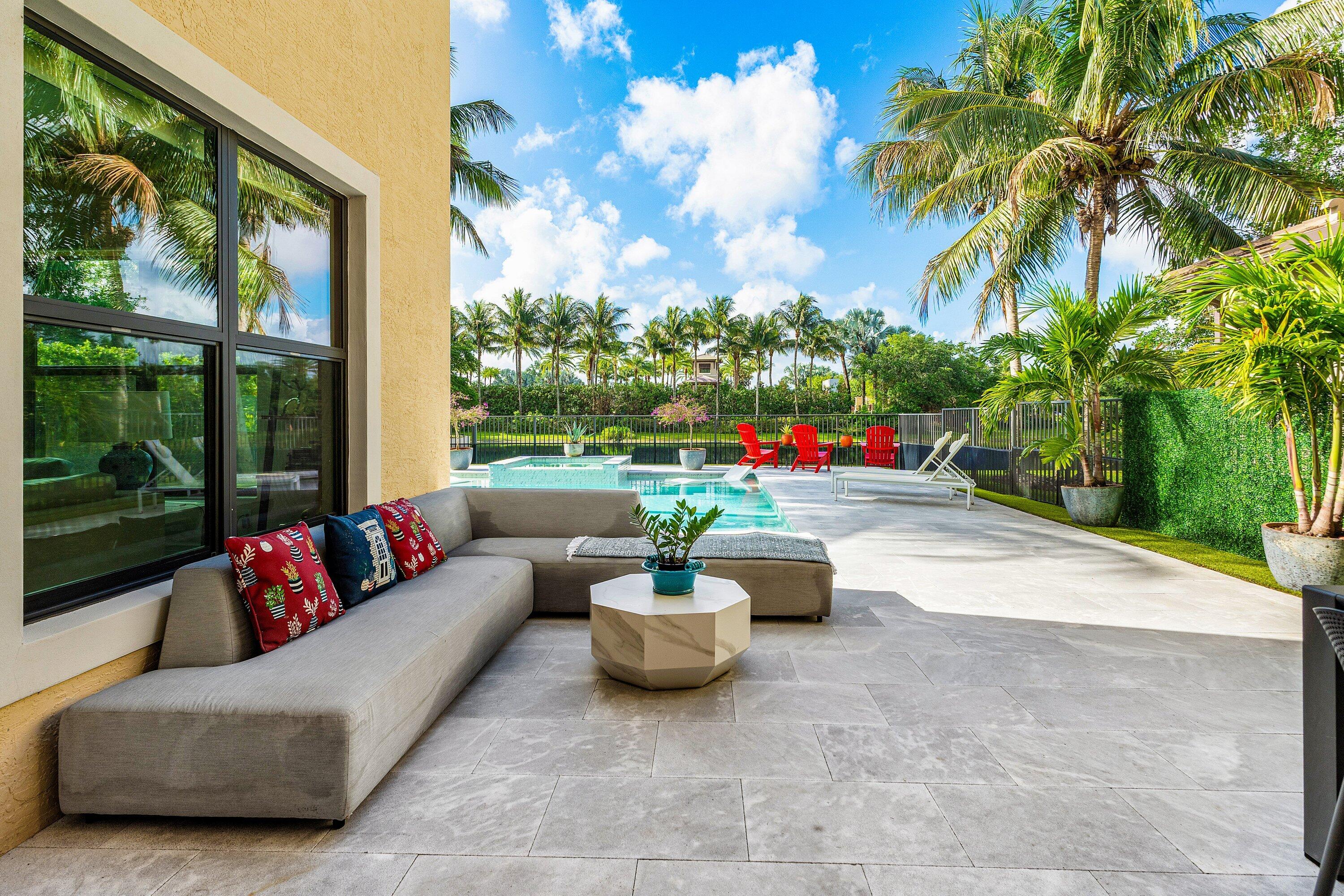 9349 Eden Roc Court Delray Beach, FL 33446 - Photo 26 of 50 a living room with patio furniture and a potted plants