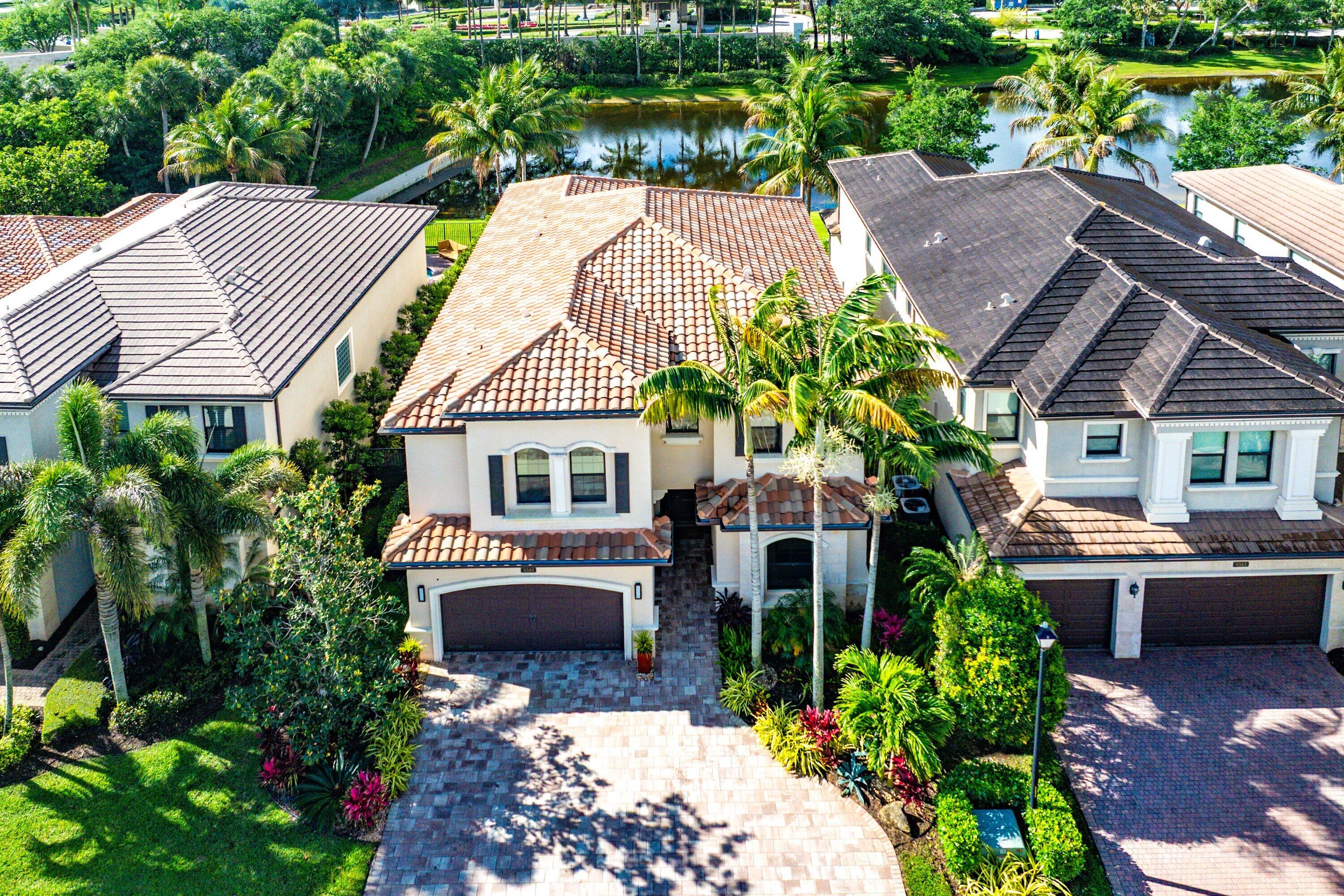 9349 Eden Roc Court Delray Beach, FL 33446 - Photo 29 of 50 a aerial view of a house with a yard and potted plants