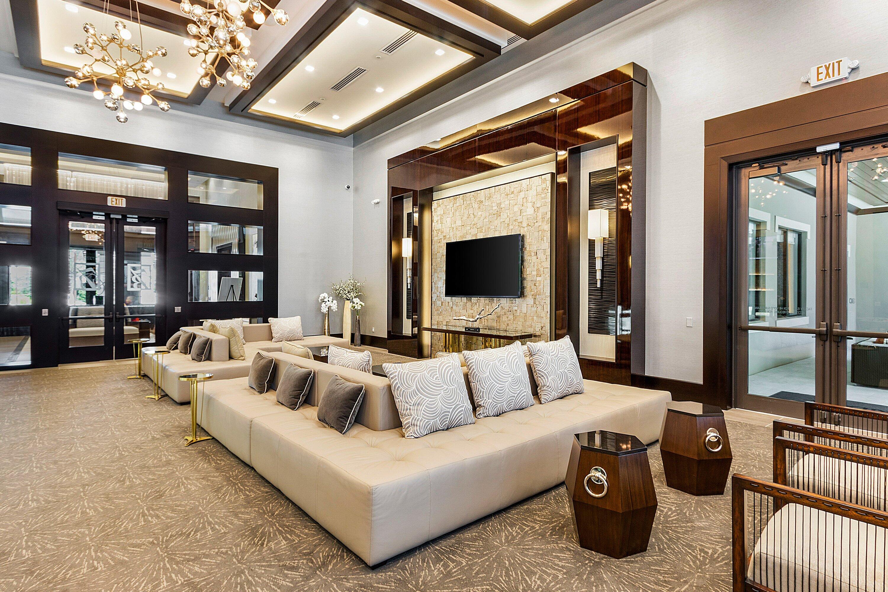 9349 Eden Roc Court Delray Beach, FL 33446 - Photo 36 of 50 a living room with furniture and a flat screen tv