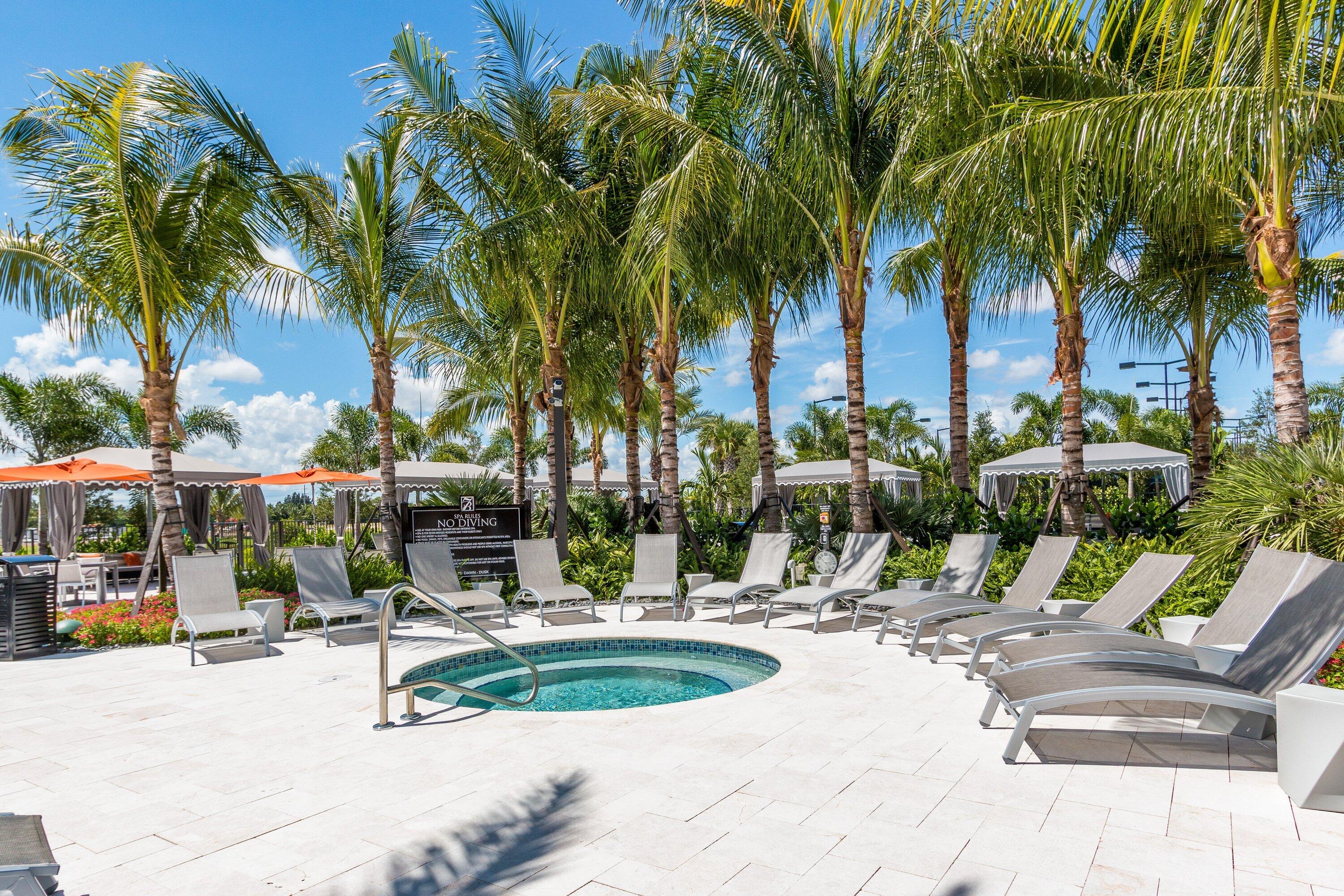 9349 Eden Roc Court Delray Beach, FL 33446 - Photo 46 of 50 a view of outdoor space with trees and swimming pool