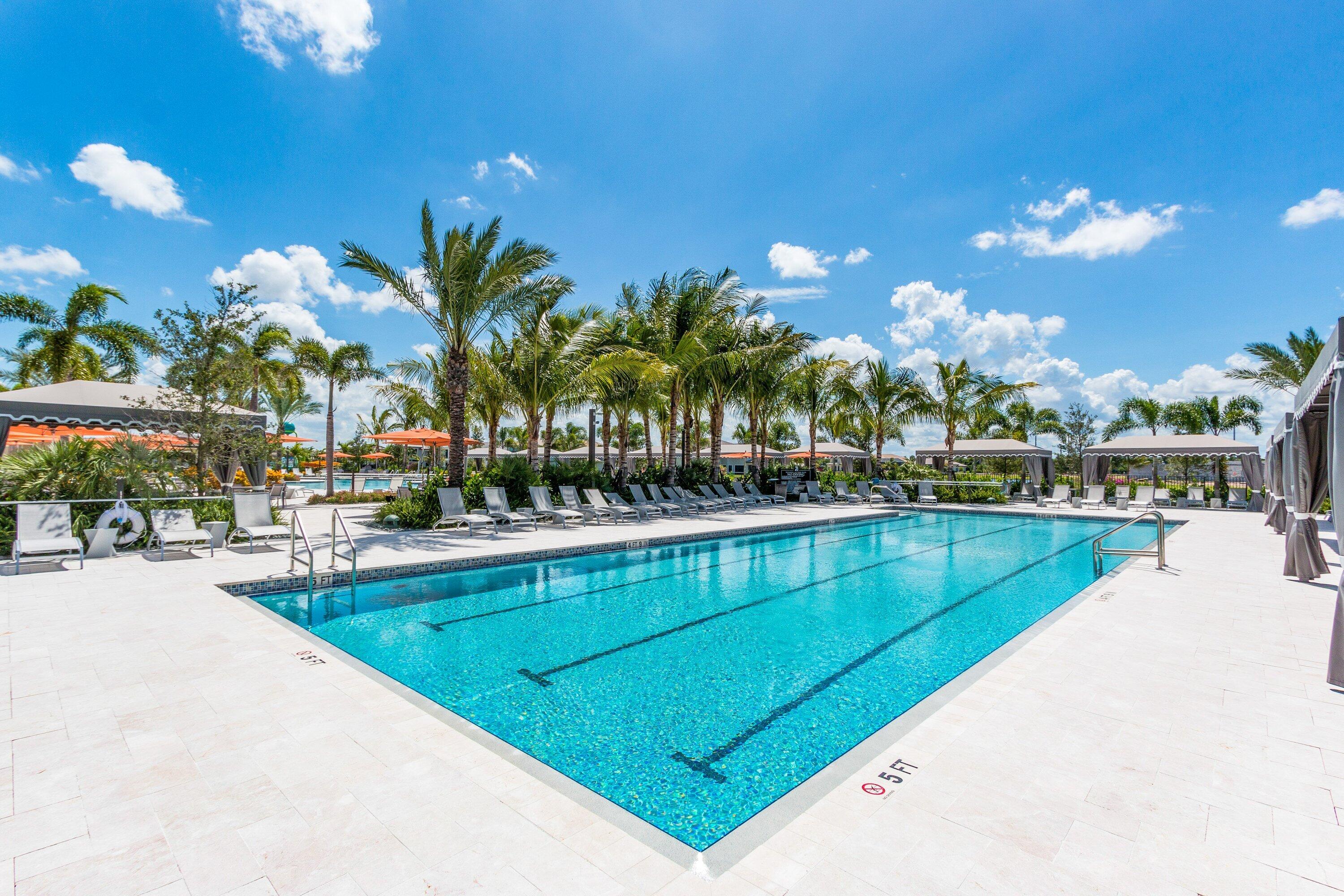 9349 Eden Roc Court Delray Beach, FL 33446 - Photo 47 of 50 a view of swimming pool with outdoor seating and city view