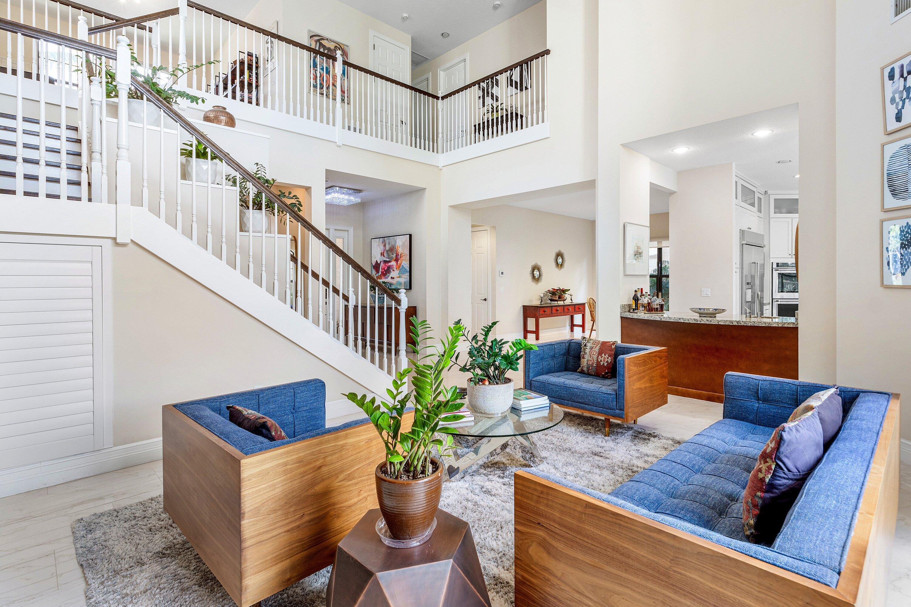 9349 Eden Roc Court Delray Beach, FL 33446 - Photo 7 of 50 a living room with furniture potted plant and a rug