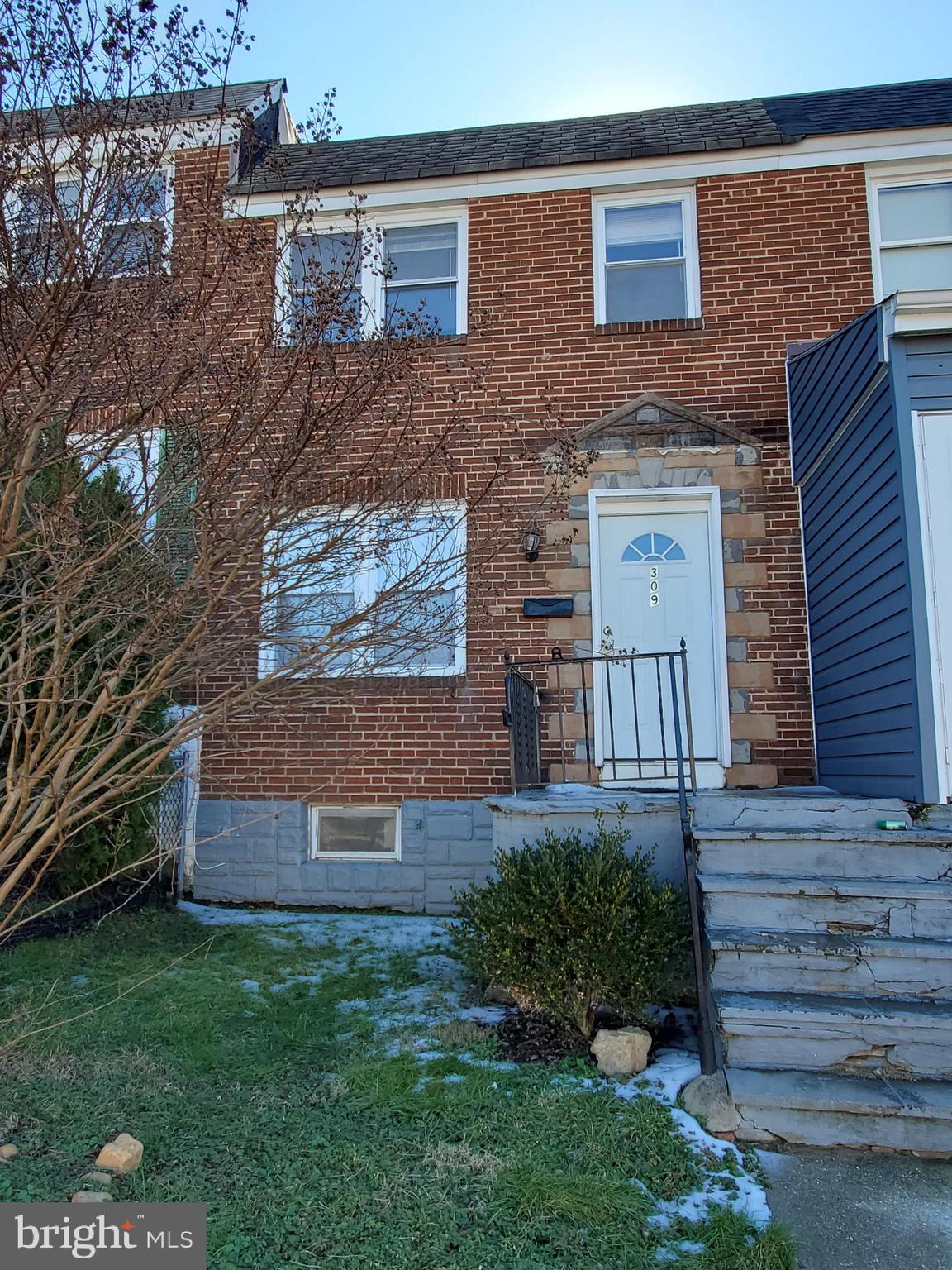 309 Arden Road West Baltimore, MD 21225 - Photo 1 of 16 a front view of a house with garden
