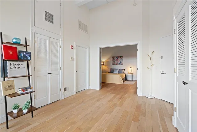 a view of a bedroom with furniture and bed
