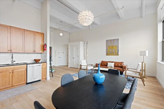 a kitchen with stainless steel appliances granite countertop a refrigerator stove a sink dishwasher and microwave with wooden cabinets