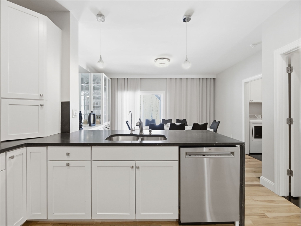 4 Wilshire Lane Pelham, NH 03076 - Photo 12 of 42 a kitchen with white cabinets and sink