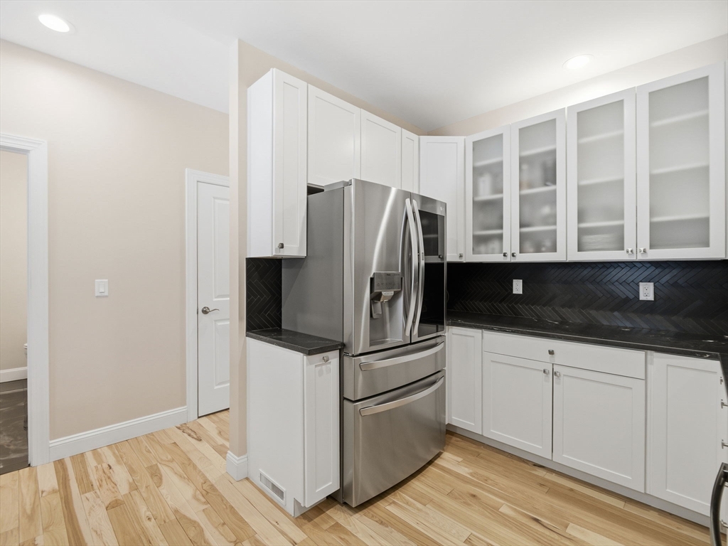 4 Wilshire Lane Pelham, NH 03076 - Photo 13 of 42 a kitchen with a refrigerator and a sink