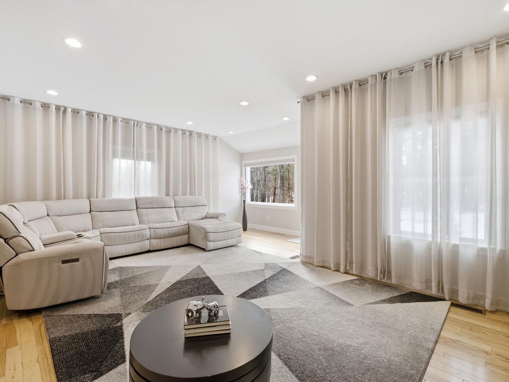 4 Wilshire Lane Pelham, NH 03076 - Photo 2 of 42 a living room with furniture and a large window