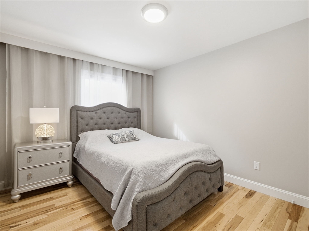 4 Wilshire Lane Pelham, NH 03076 - Photo 21 of 42 a bedroom with a bed and a window