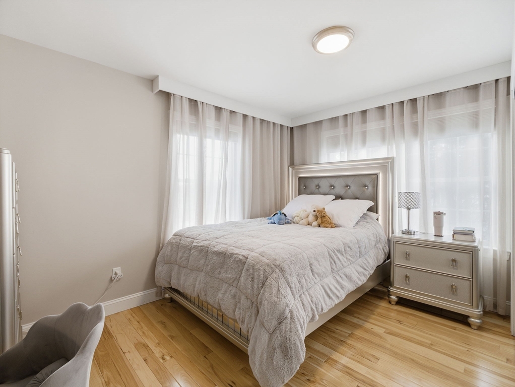 4 Wilshire Lane Pelham, NH 03076 - Photo 24 of 42 a bedroom with a bed and a window