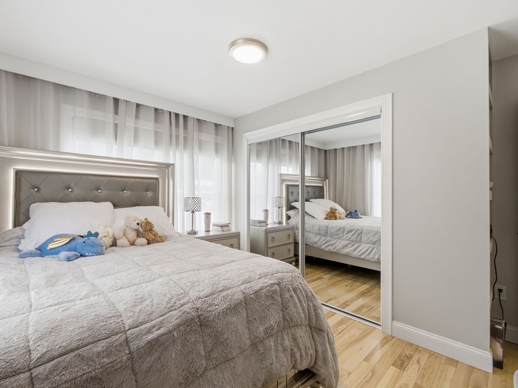 4 Wilshire Lane Pelham, NH 03076 - Photo 25 of 42 a bedroom with a bed and a large window