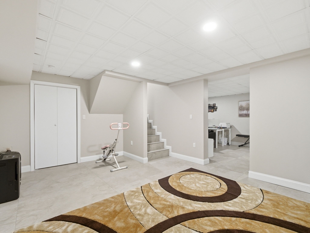 4 Wilshire Lane Pelham, NH 03076 - Photo 27 of 42 a room with furniture and a wooden floor