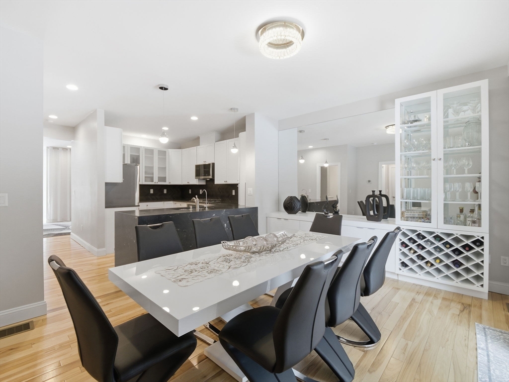 4 Wilshire Lane Pelham, NH 03076 - Photo 5 of 42 a large kitchen with a table and chairs