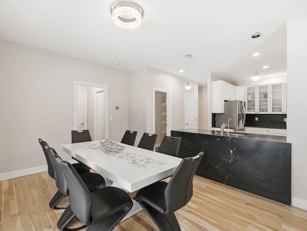 4 Wilshire Lane Pelham, NH 03076 - Photo 7 of 42 a view of a dining room with furniture