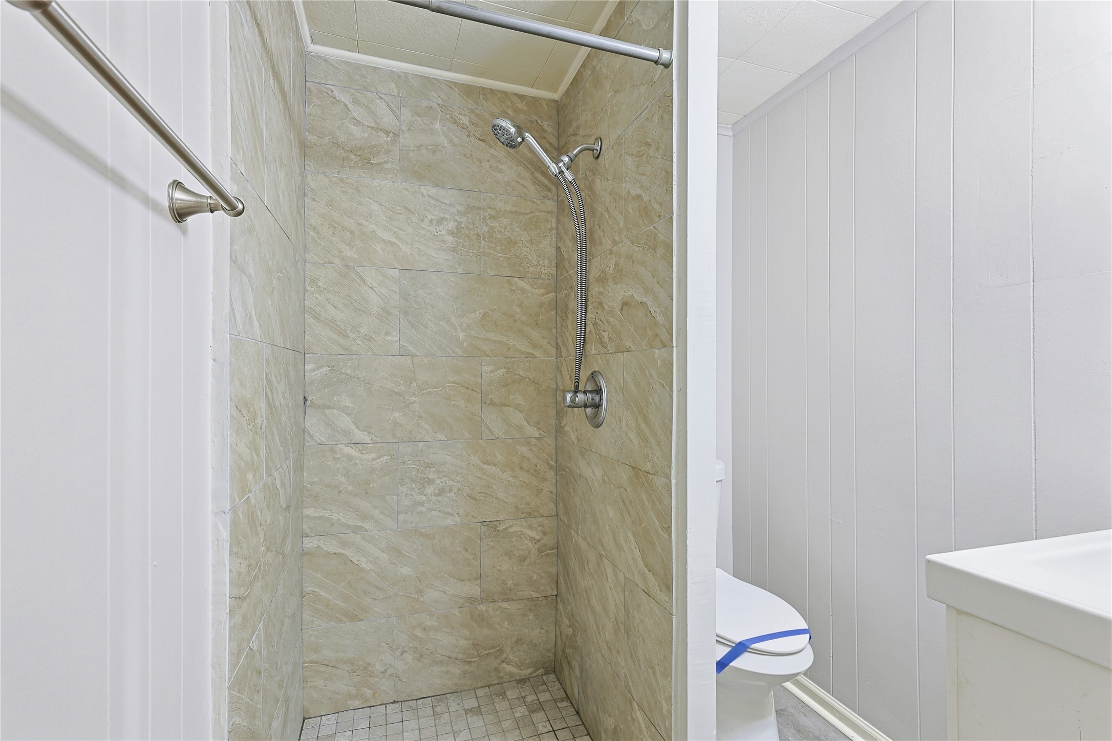 207 Farrer Street Angleton, TX 77515 - Photo 24 of 24 a bathroom with a shower and toilet