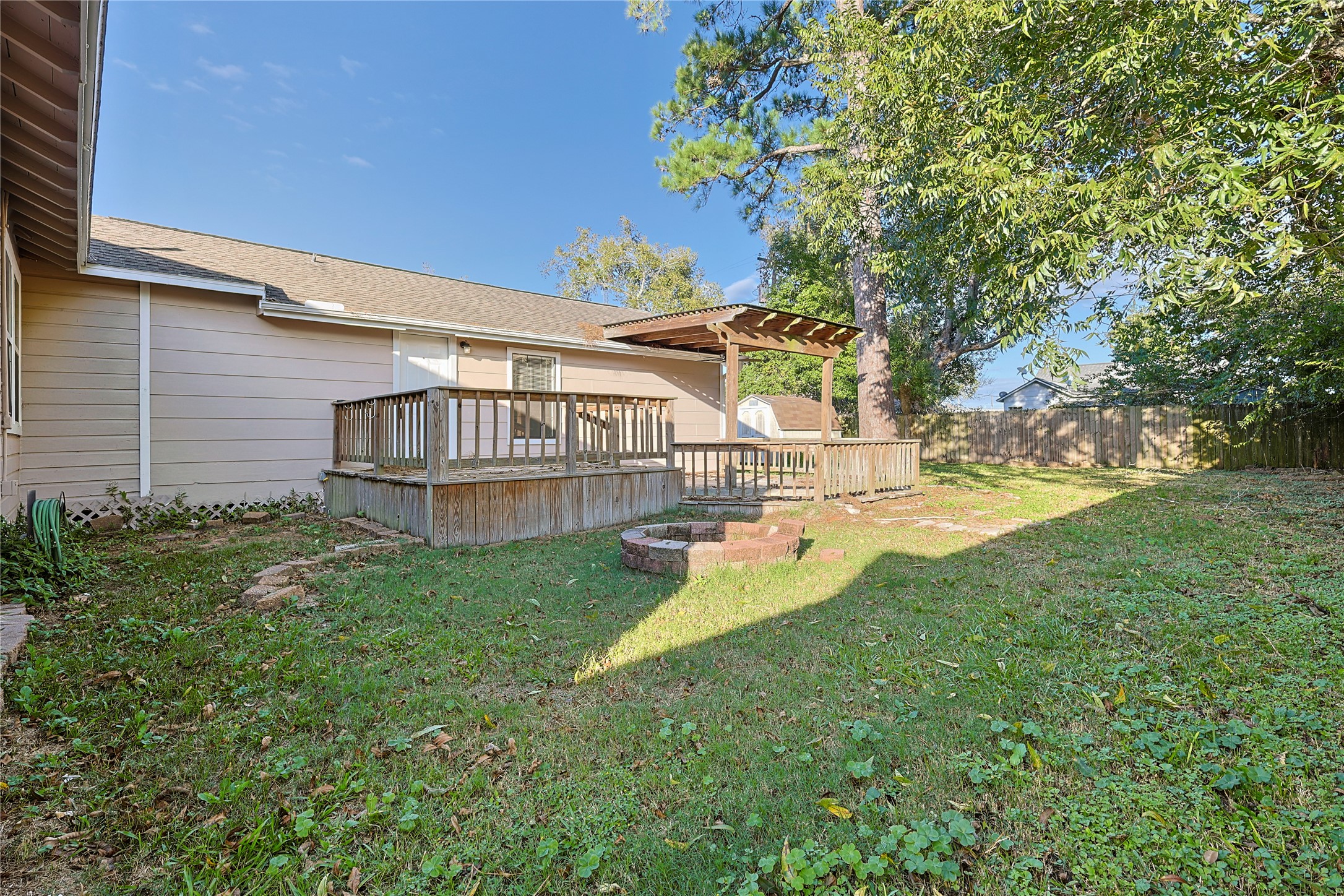 207 Farrer Street Angleton, TX 77515 - Photo 6 of 24 a view of a house with backyard and sitting area