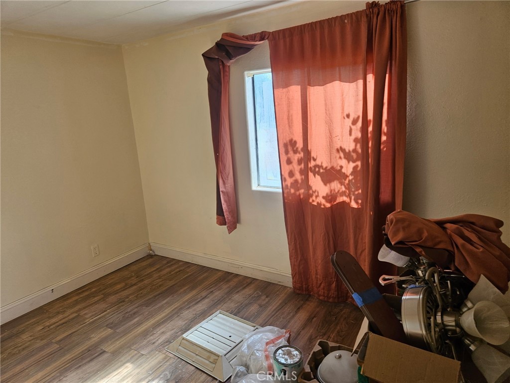 16685 Tehama Dam Road Cottonwood, CA 96022 - Photo 14 of 19 a view of a room with wooden floor and furniture
