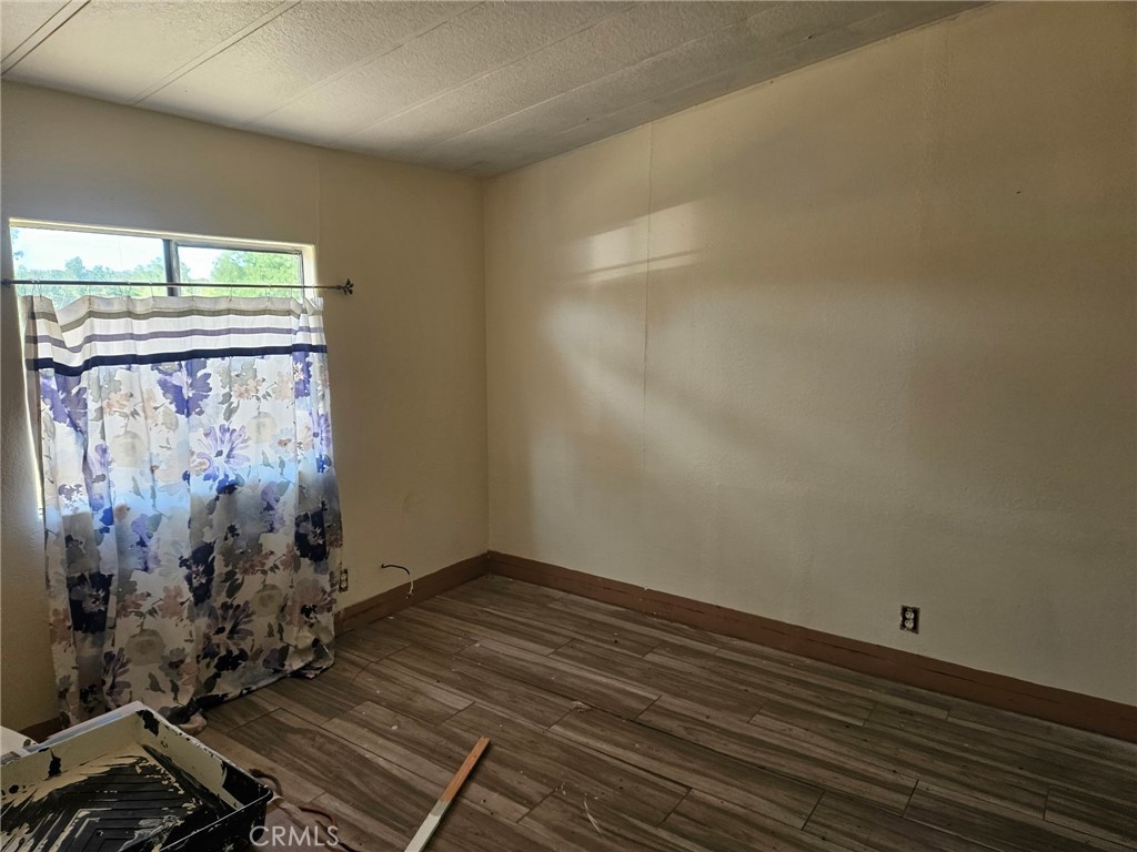 16685 Tehama Dam Road Cottonwood, CA 96022 - Photo 16 of 19 a view of a room with wooden floor